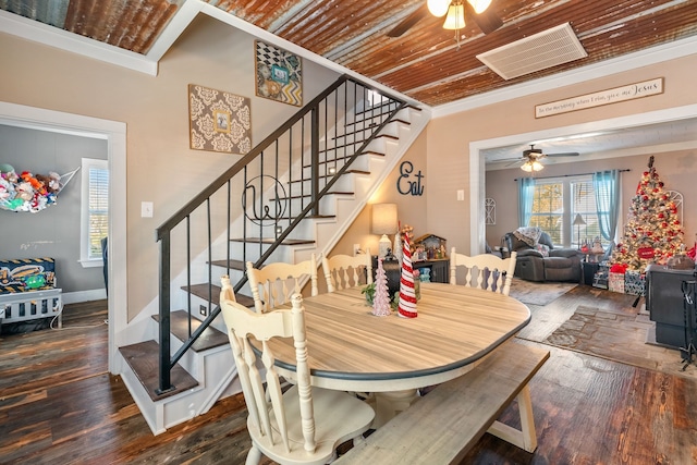 dining room featuring wooden ceiling, crown molding, ceiling fan, and dark wood-type flooring