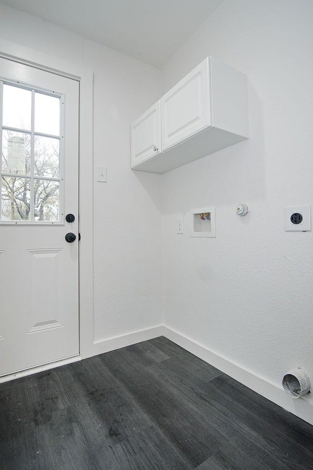 laundry area with dark wood-type flooring, cabinets, washer hookup, and hookup for an electric dryer