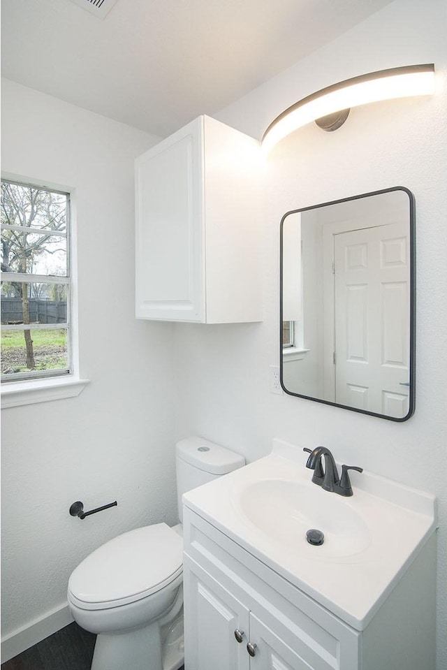 bathroom with vanity and toilet