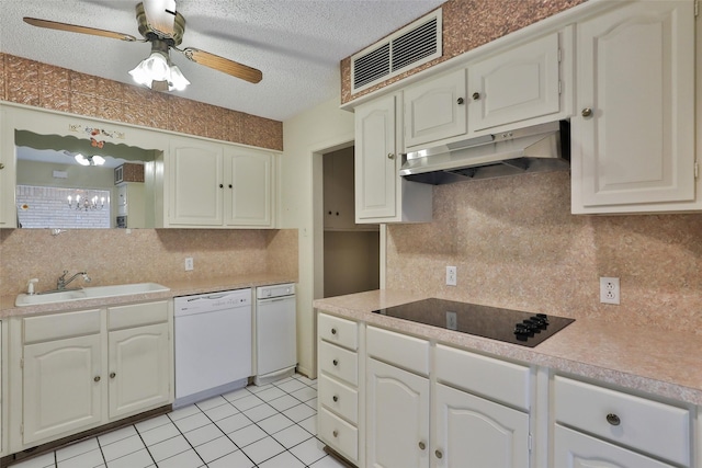 kitchen featuring white dishwasher, sink, white cabinetry, and black electric stovetop