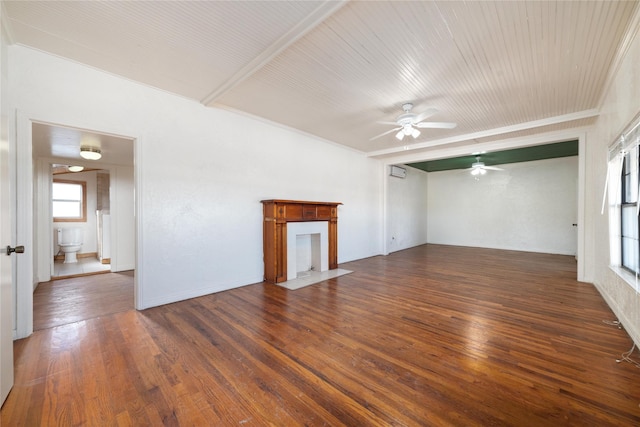 unfurnished living room with ceiling fan, dark hardwood / wood-style flooring, and a healthy amount of sunlight