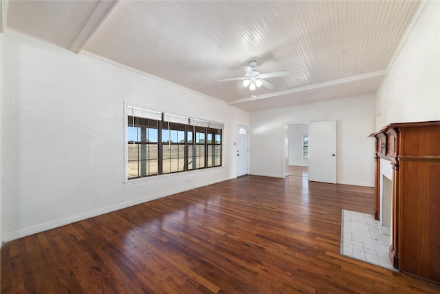 unfurnished living room featuring ceiling fan, beam ceiling, crown molding, and dark wood-type flooring