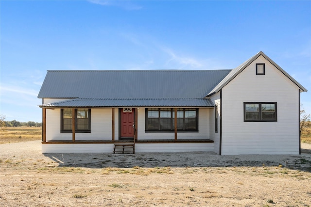 back of property with covered porch