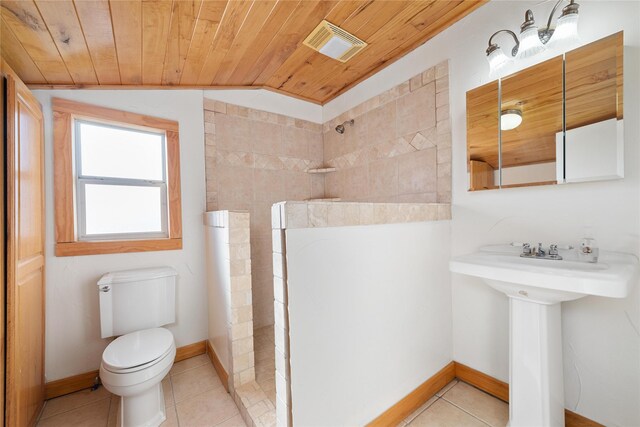 bathroom featuring tile patterned floors, a shower, wood ceiling, and vaulted ceiling