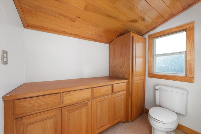 bathroom with tile patterned flooring, lofted ceiling, toilet, and wood ceiling