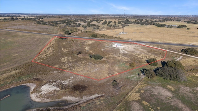 birds eye view of property with a rural view