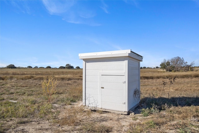 view of outdoor structure featuring a rural view