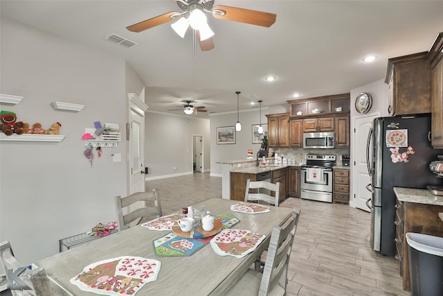 dining area featuring crown molding