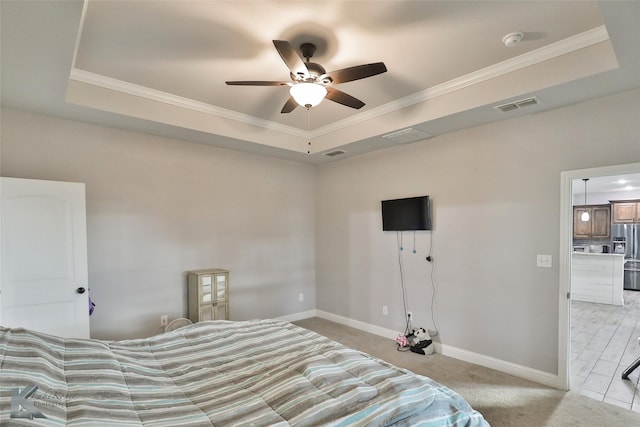 carpeted bedroom featuring ceiling fan, stainless steel fridge, crown molding, and a tray ceiling