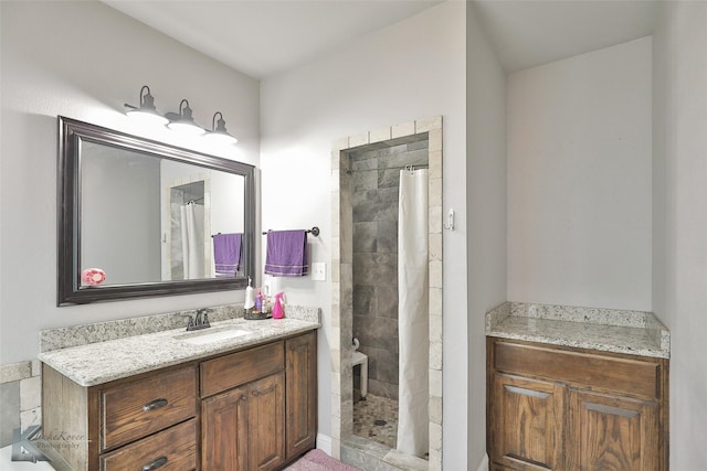 bathroom with vanity and walk in shower