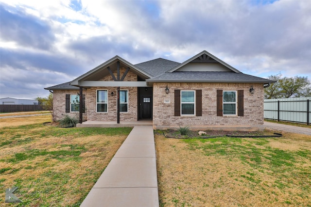 craftsman inspired home with a front yard