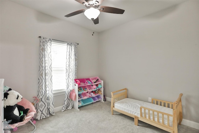 carpeted bedroom with ceiling fan