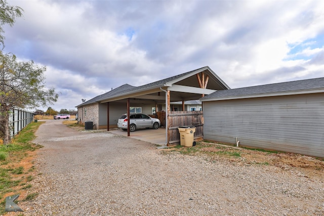 view of parking / parking lot featuring a carport