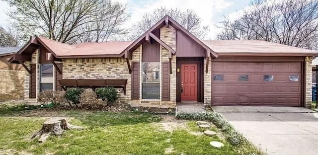 view of front of property with a front yard and a garage