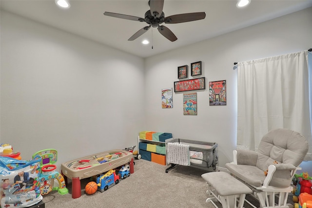 rec room featuring ceiling fan and carpet flooring