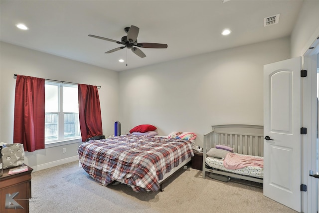 carpeted bedroom featuring ceiling fan