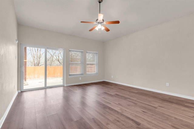 empty room featuring ceiling fan and hardwood / wood-style floors