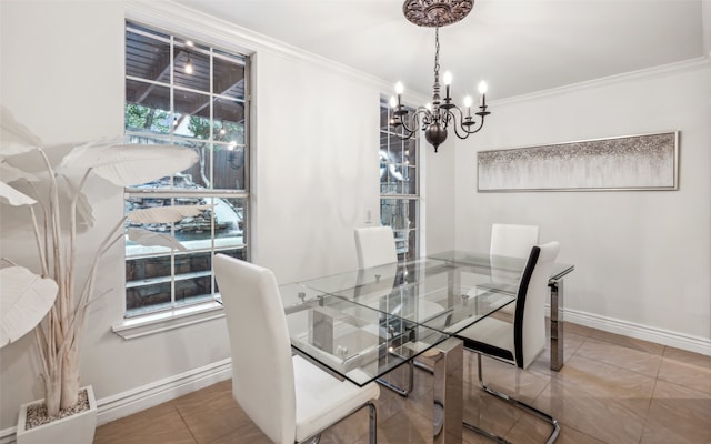 tiled dining area featuring crown molding and an inviting chandelier