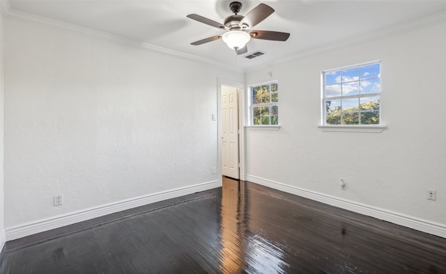 spare room with crown molding, dark hardwood / wood-style flooring, and ceiling fan