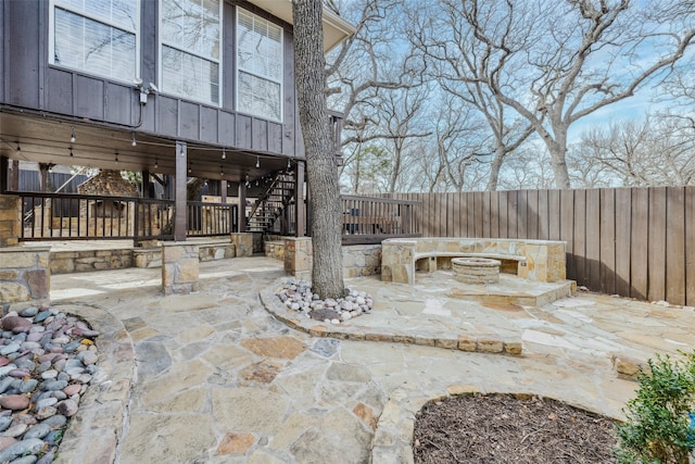 view of patio / terrace with an outdoor fire pit