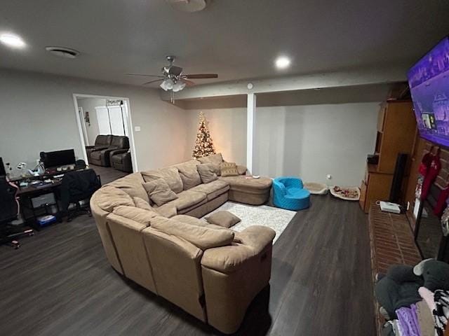 living room with dark hardwood / wood-style floors and ceiling fan