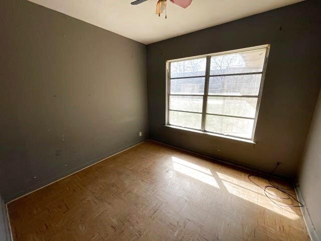 spare room featuring a ceiling fan