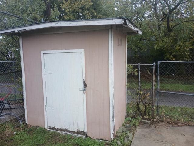 view of shed with fence