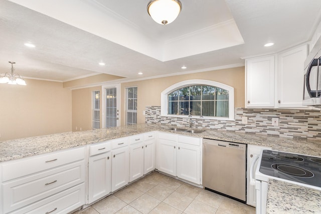 kitchen featuring kitchen peninsula, white cabinetry, pendant lighting, and stainless steel appliances