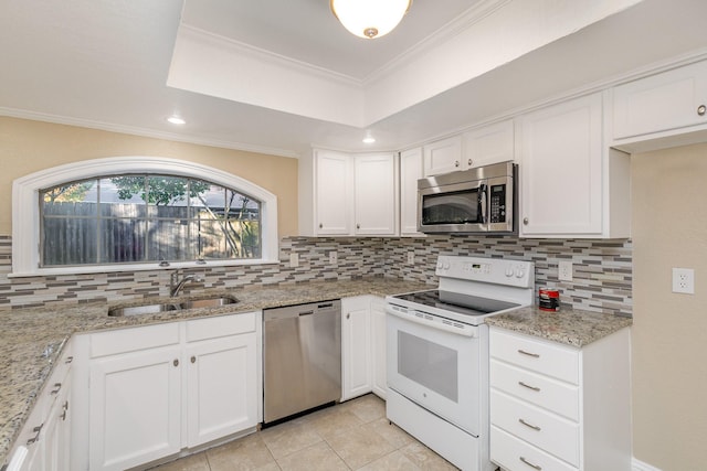 kitchen featuring white cabinetry, sink, ornamental molding, and appliances with stainless steel finishes