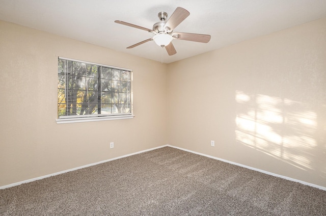 carpeted empty room with ceiling fan