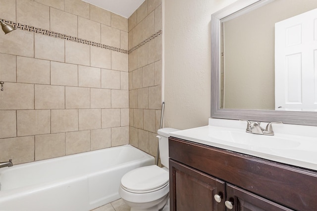 full bathroom with vanity, toilet, and tiled shower / bath