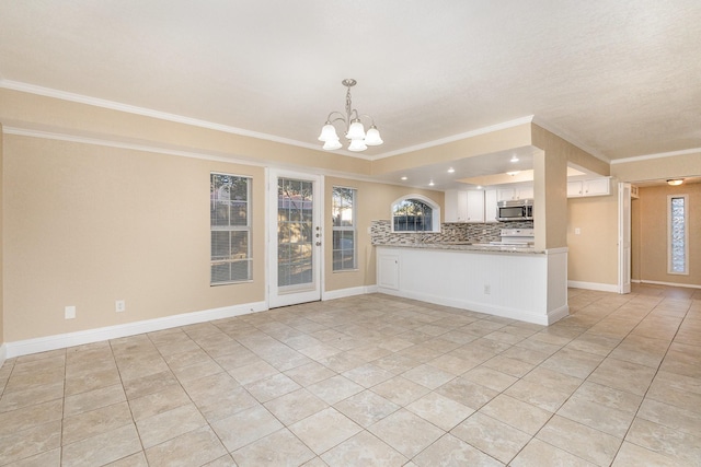 kitchen featuring an inviting chandelier, kitchen peninsula, decorative backsplash, light tile patterned flooring, and white cabinetry