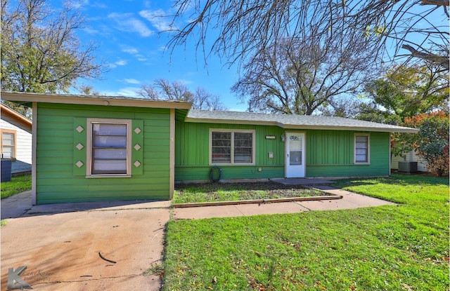 single story home with a front lawn and central AC unit