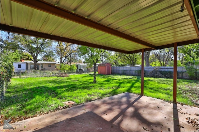 view of patio featuring a storage unit