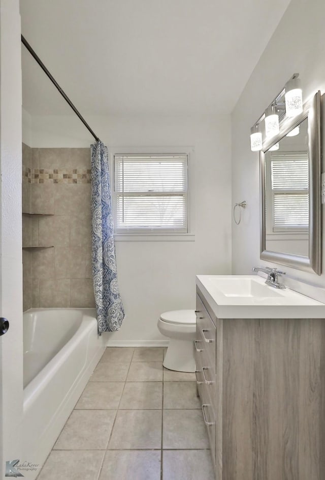 full bathroom featuring shower / tub combo with curtain, vanity, tile patterned floors, and toilet