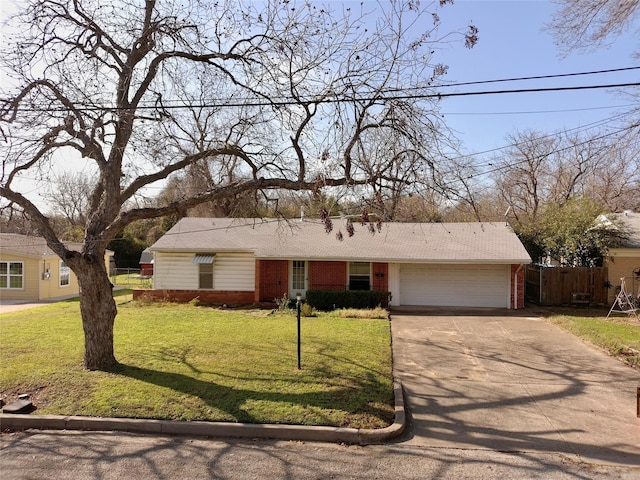 ranch-style home with a front yard and a garage