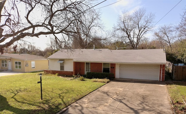 ranch-style home with a front yard and a garage