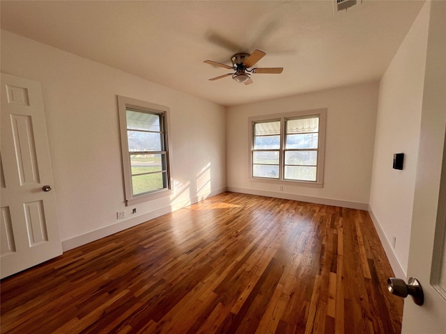 spare room featuring ceiling fan and hardwood / wood-style floors