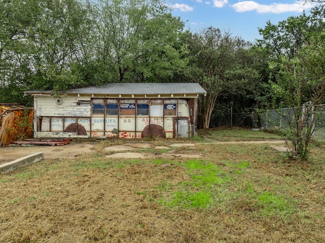 view of outbuilding with a lawn