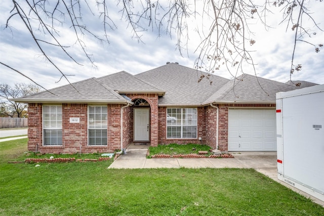 ranch-style home featuring a garage and a front lawn