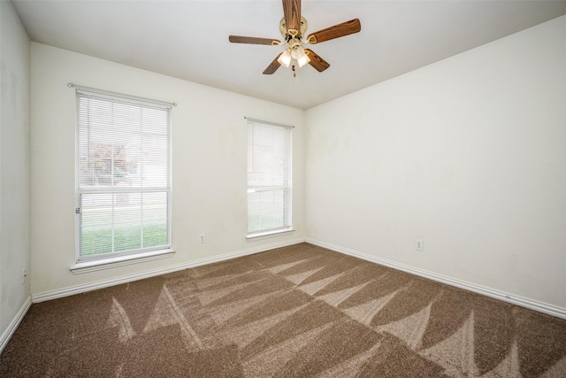 empty room with carpet floors and ceiling fan