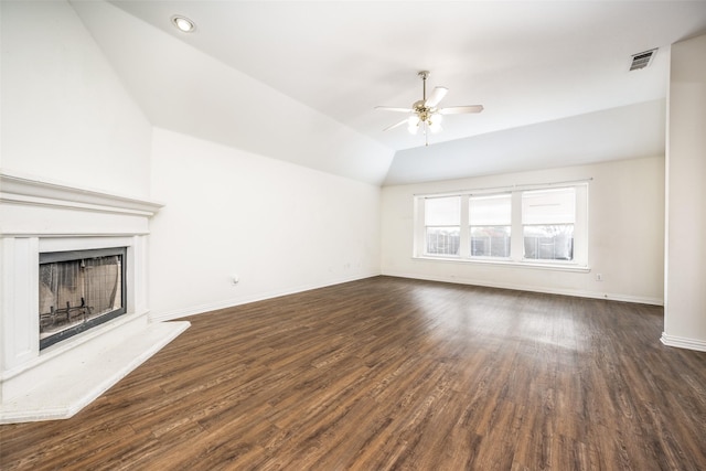 unfurnished living room with ceiling fan, dark hardwood / wood-style flooring, and lofted ceiling