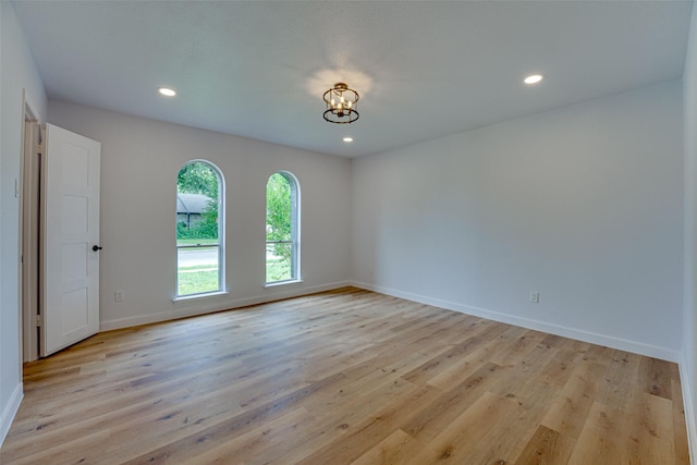 empty room with light hardwood / wood-style flooring