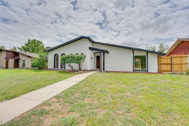 ranch-style house with a front yard