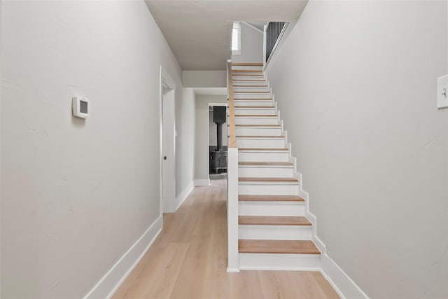 stairs with hardwood / wood-style flooring