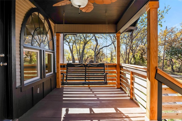 wooden terrace featuring ceiling fan