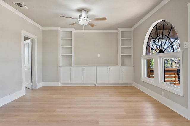 interior space featuring light hardwood / wood-style floors, ceiling fan, and crown molding