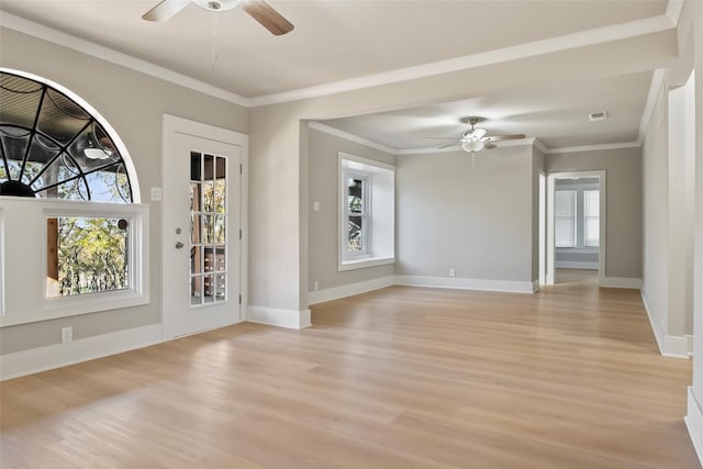 unfurnished room with ceiling fan, ornamental molding, and light wood-type flooring