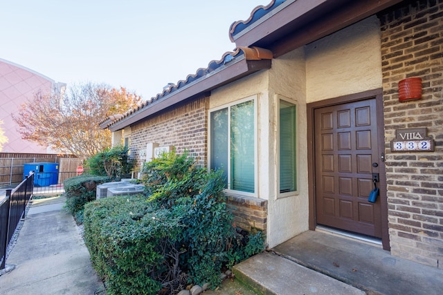 property entrance featuring central air condition unit