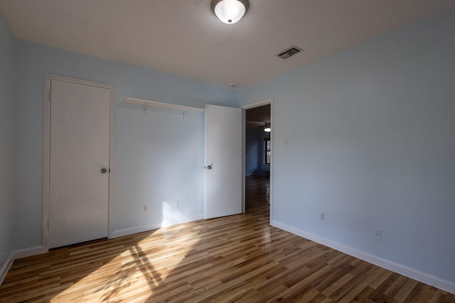 unfurnished bedroom with wood-type flooring